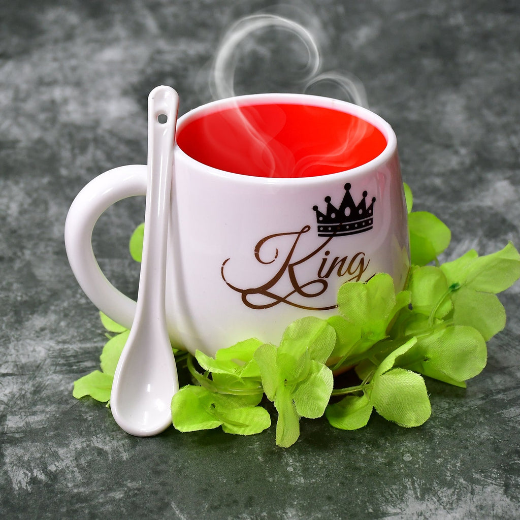 Vibrant multi-design plastic tea mug with a matching spoon.