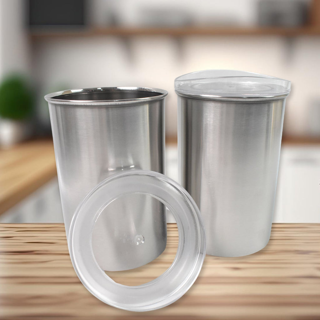 A single stainless steel airtight container with a see-through lid on a modern kitchen counter.