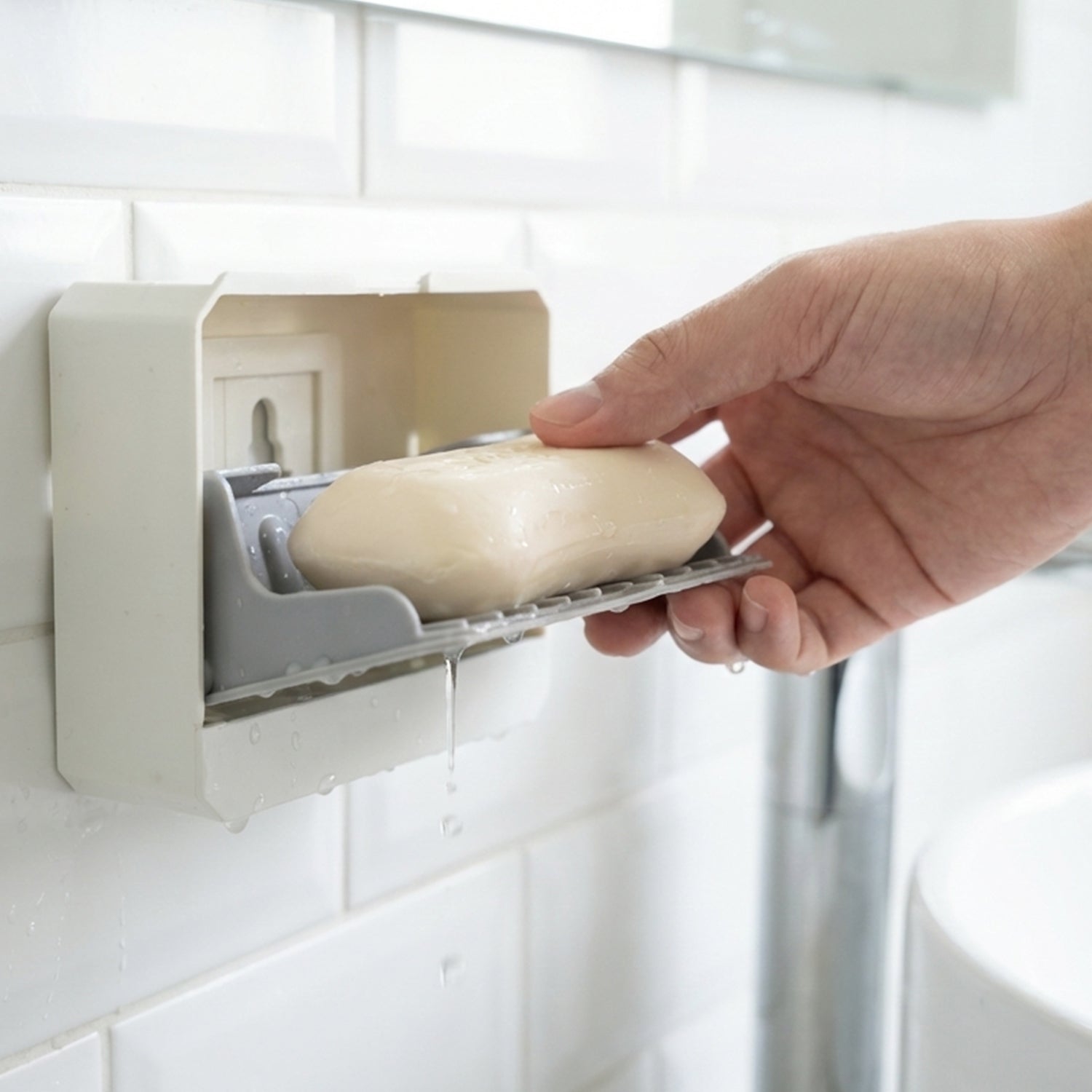Soap holder tray showing drainage slots for water flow