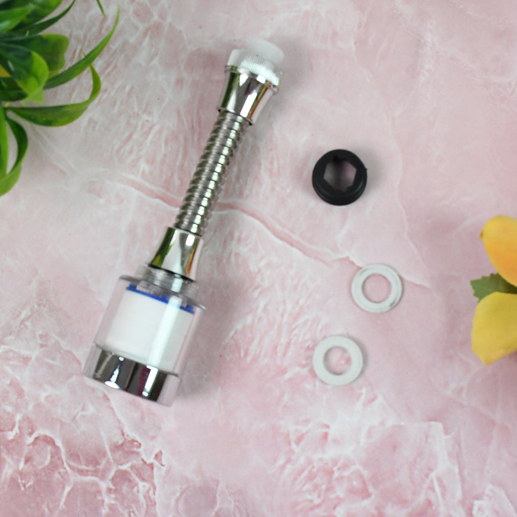 Person washing vegetables under the adjustable, water-saving faucet sprinkler.