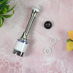 Person washing vegetables under the adjustable, water-saving faucet sprinkler.