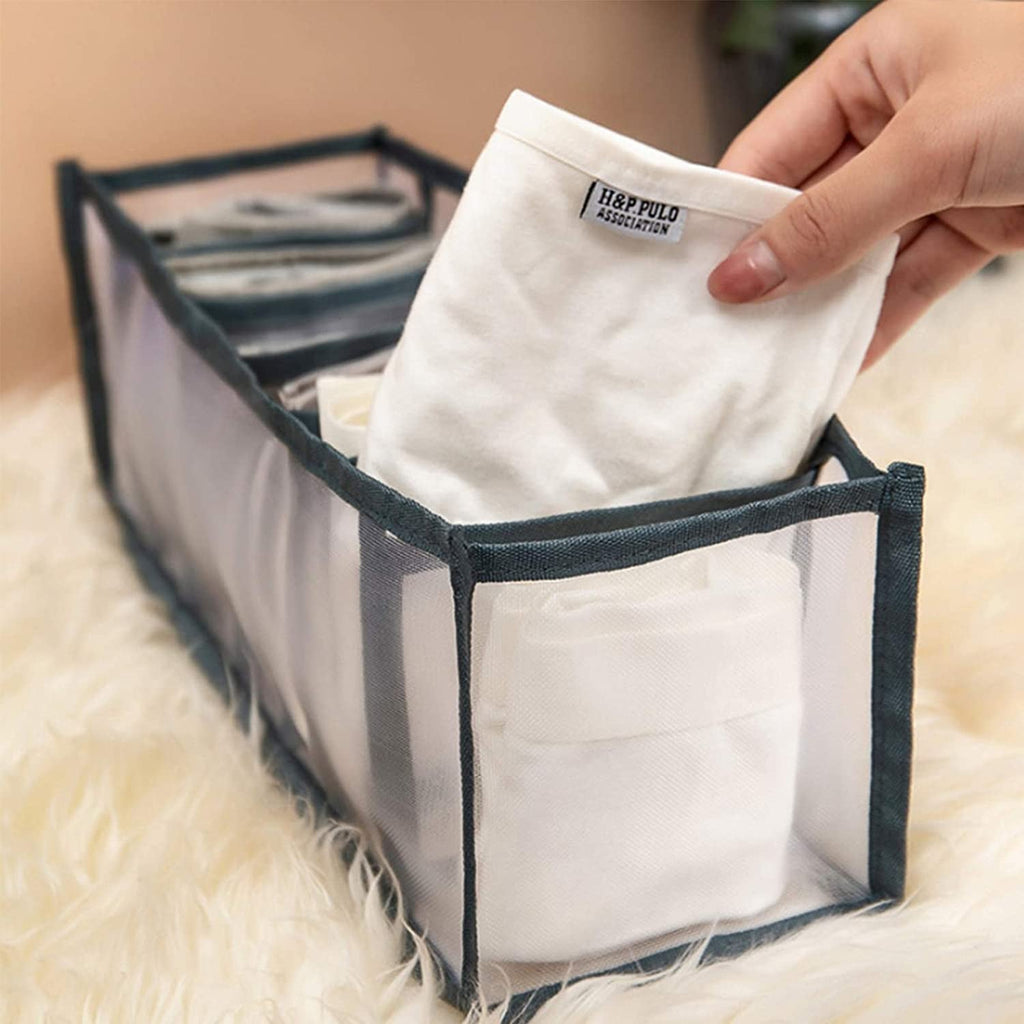 Organivo 7 Grid Clothes Organizer neatly storing folded jeans and t-shirts.