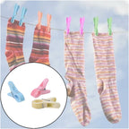 Pink plastic cloth clip securely holding fabric in place