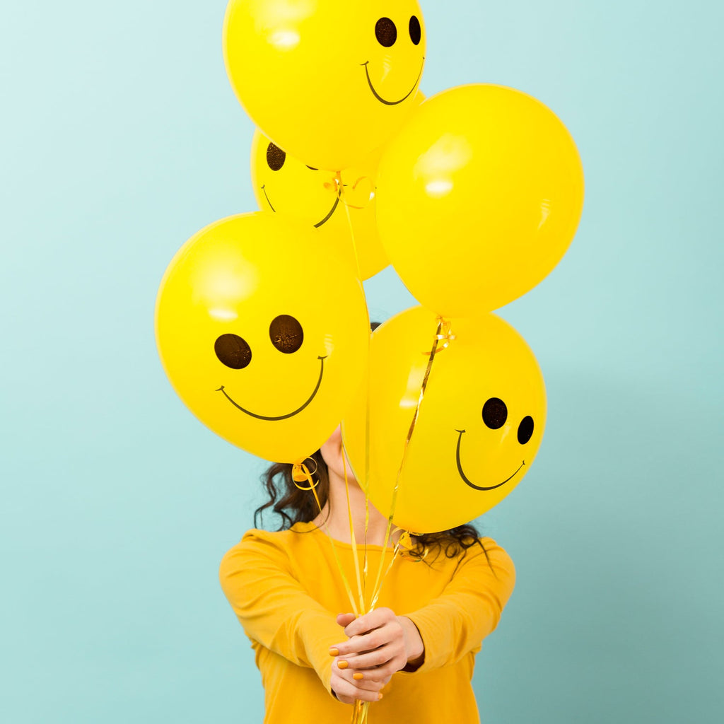 Vibrant smiley latex balloons for a cheerful party atmosphere.