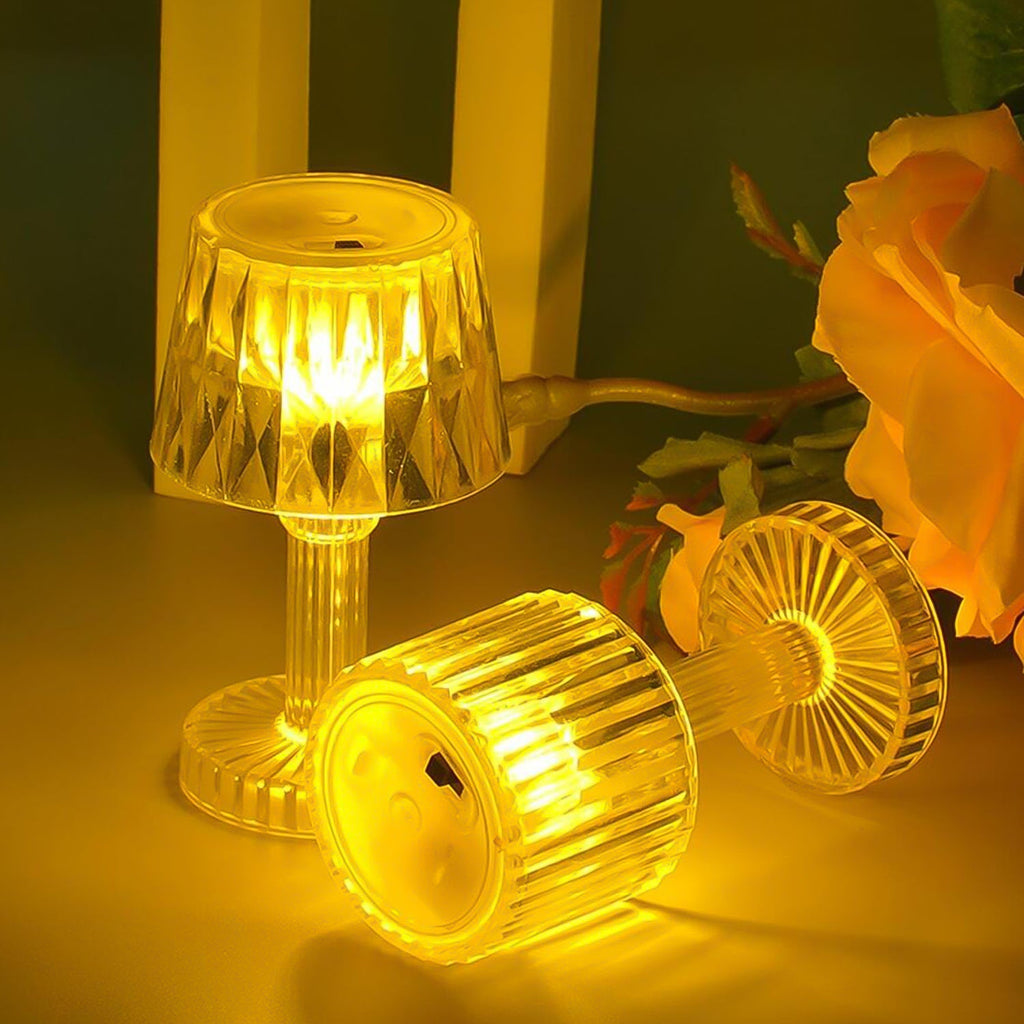 Portable small LED candle lamp with golden bulb light on table