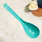 A single food-grade plastic serving spoon showcasing its ergonomic handle and practical design.