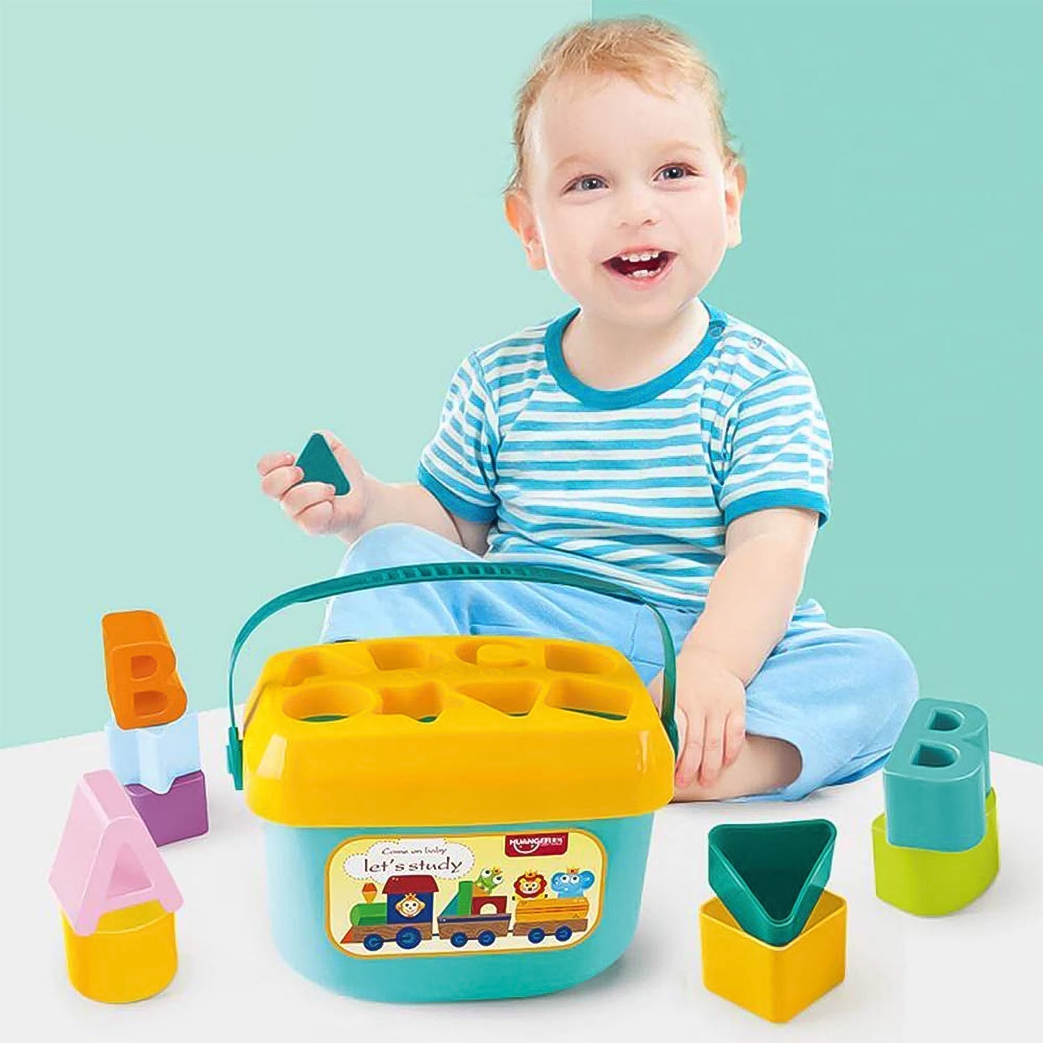 An overhead shot showing different colored geometric shapes of the stacking toy.