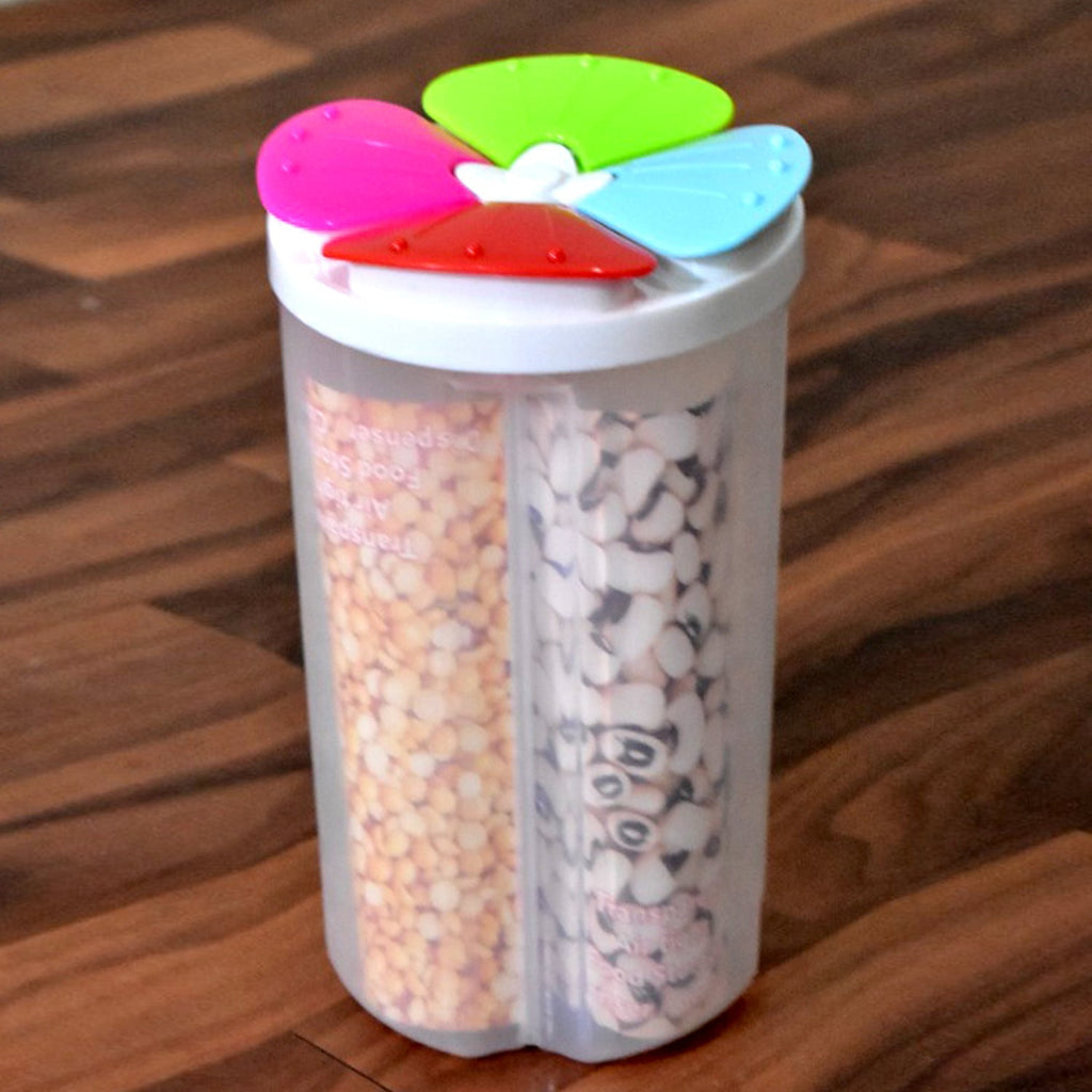 Transparent 4 section storage container with a pink lid, holding various cereals.