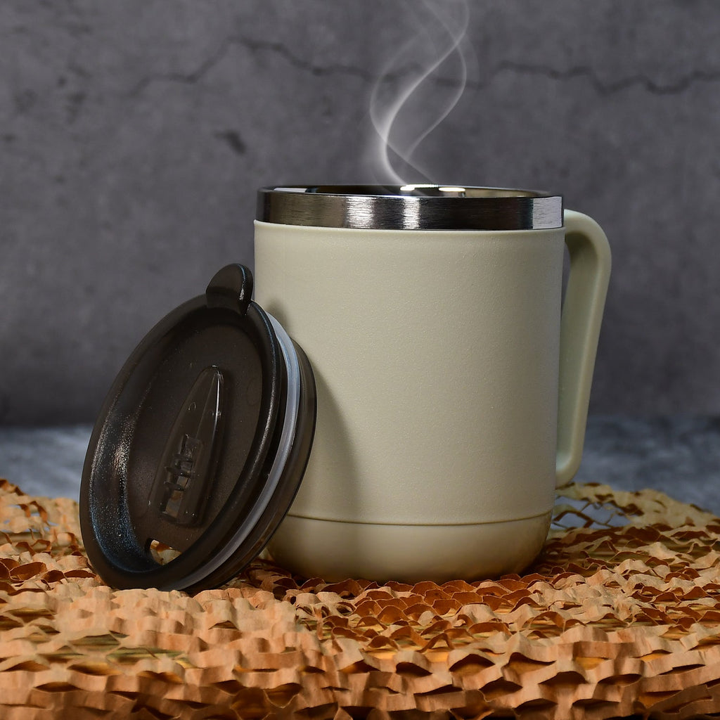 A sleek stainless steel coffee mug with an ergonomic handle.