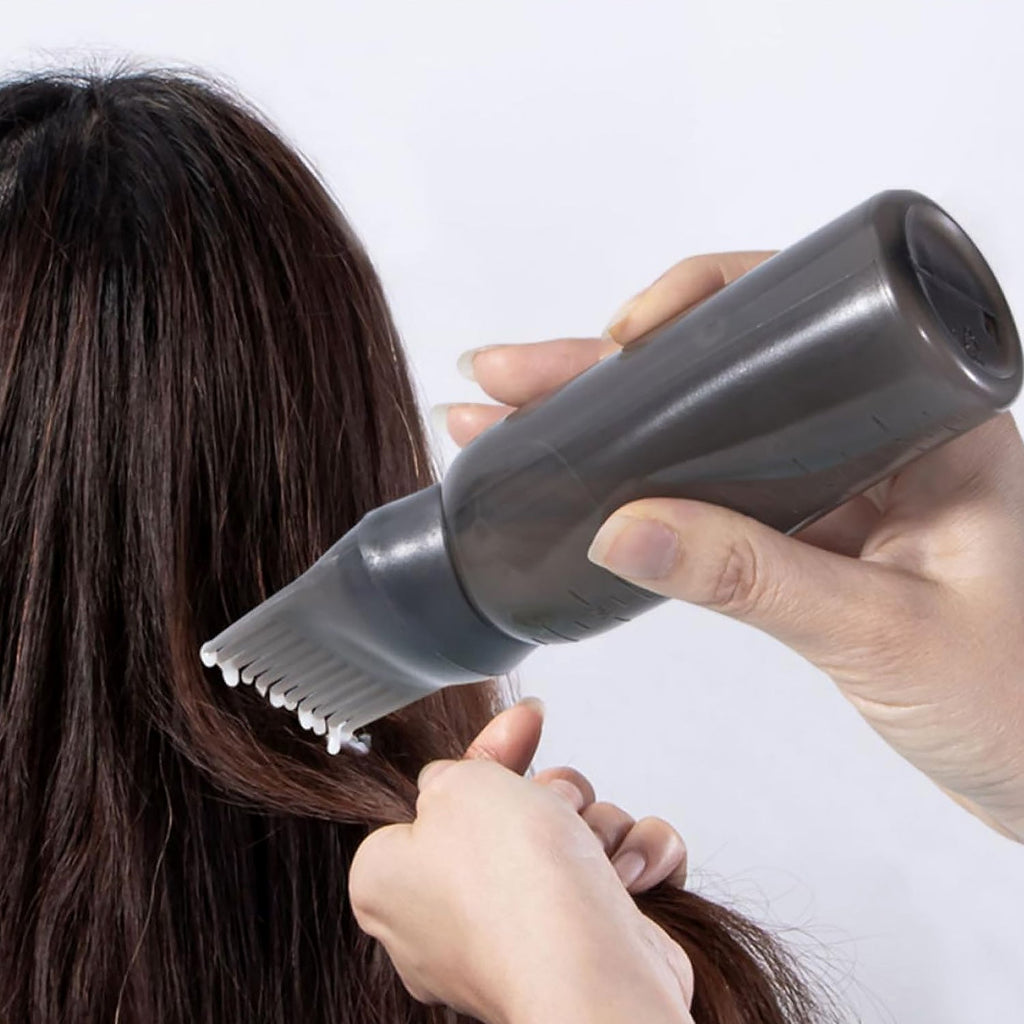 Side angle view of the professional hair colour applicator bottle, highlighting its design.