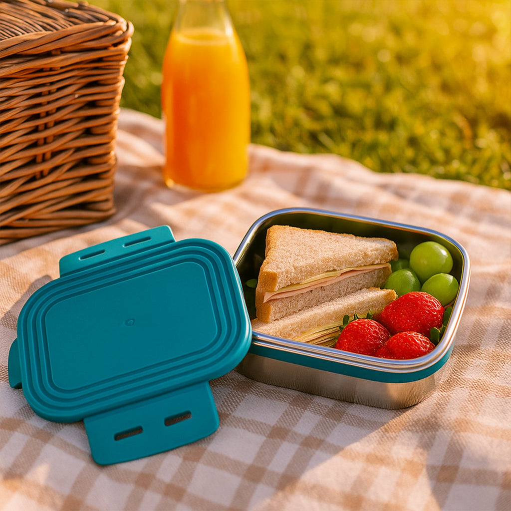 Mini food container next to lunchbox showing compact 200ml stainless steel storage