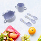Individual components of the 7-piece bamboo fibre baby feeding set, including the cutlery and plate.