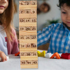 Wooden blocks tumbling down as the tower collapses during an exciting round of the game.