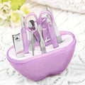 Compact apple-shaped manicure set with 8 stainless steel tools.