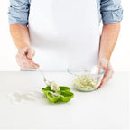 The cactus silicone ice cream mold being filled with a colorful liquid for a DIY ice pop.