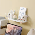 Multifunctional elephant wall shelf for kitchen and bathroom organization.