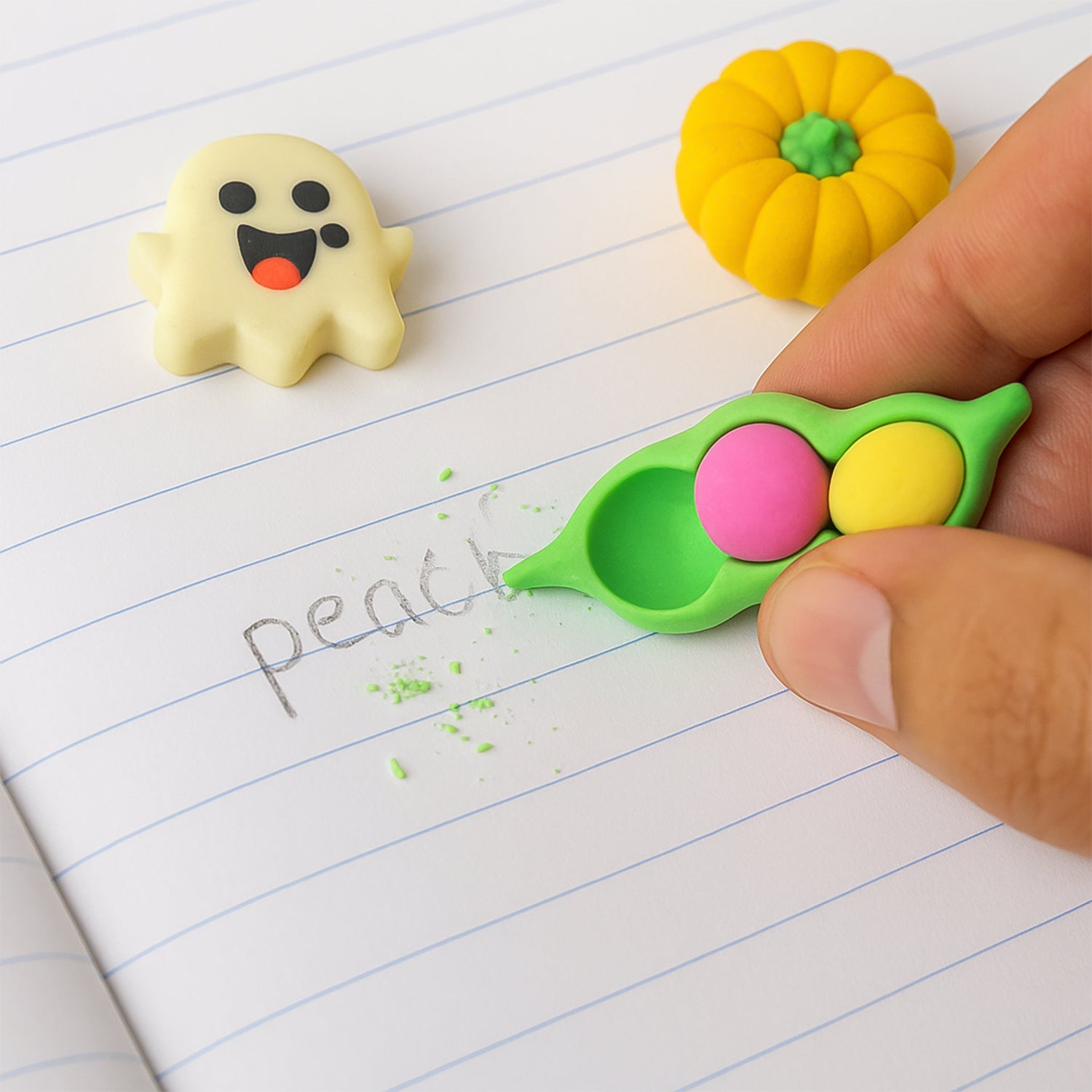 A fun white ghost-shaped cartoon eraser, ideal for kids' school bags and art supplies.