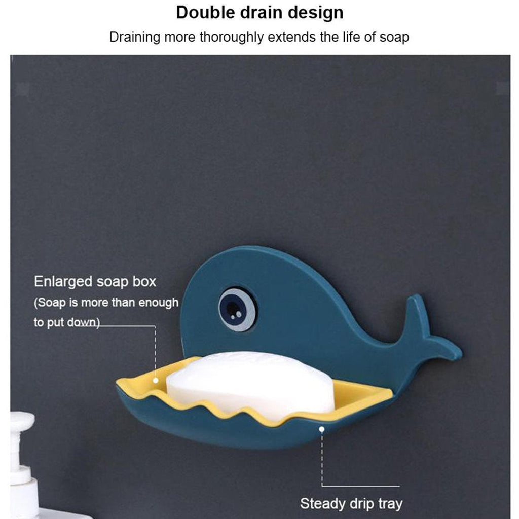 White fish shape soap dish installed on a tiled shower wall, showcasing its adhesive mount.