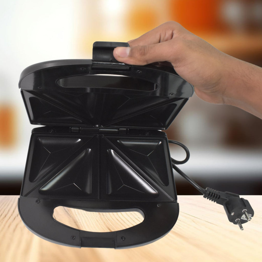 Sandwich maker cool-touch handle ensuring safe usage during cooking