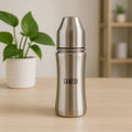 Ganesh 250ml stainless steel baby bottle with anti-colic nipple, ideal for infants.