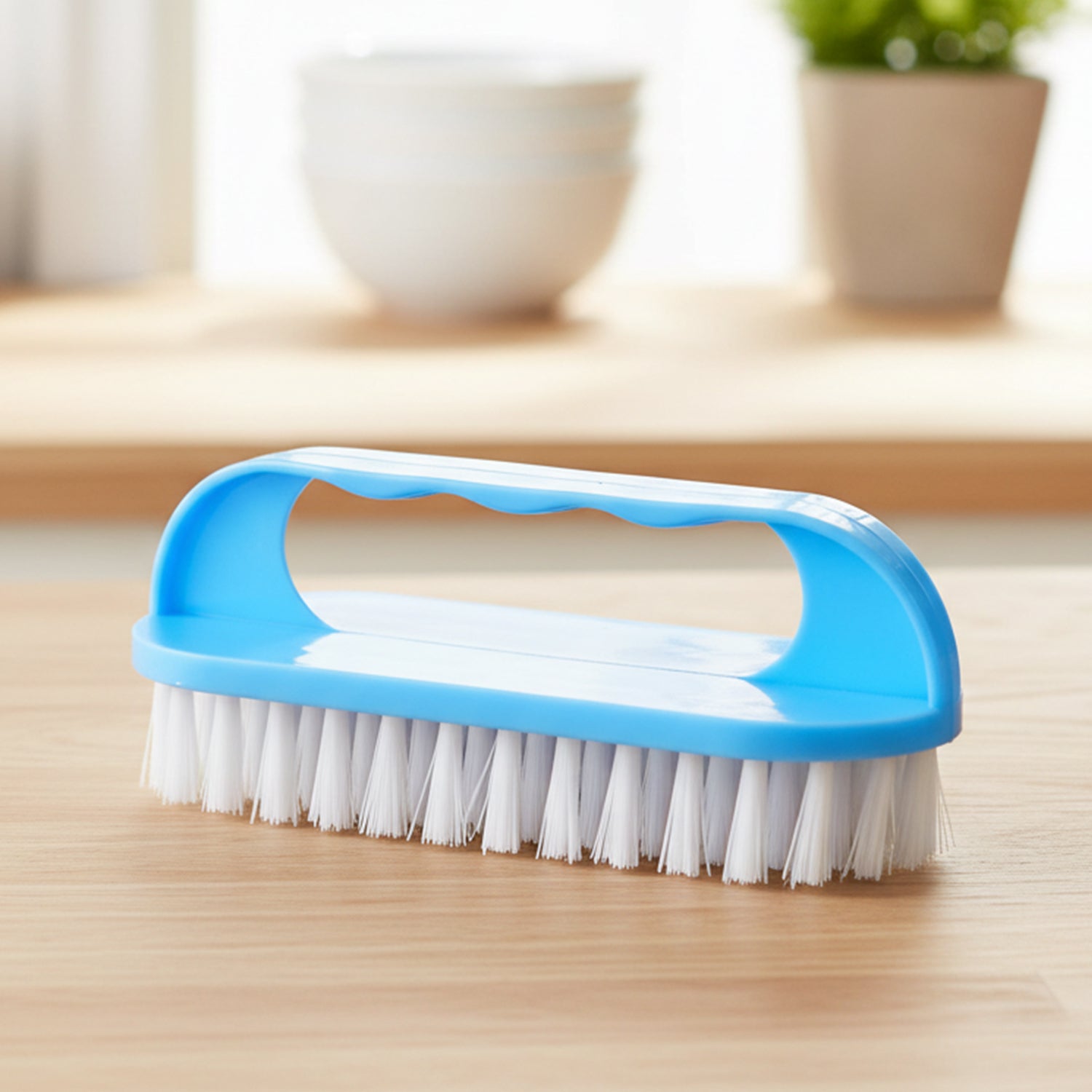 Top view of handheld cleaning brush showing durable build and sturdy bristles.