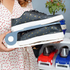 Multiple adjustable shoe organizers arranged in a closet, creating a tidy and organized shoe collection.