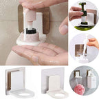 White adhesive hook supporting shampoo and body wash bottles in a modern bathroom.