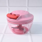 Top view of hand-pull vegetable chopper highlighting pull-cord mechanism
