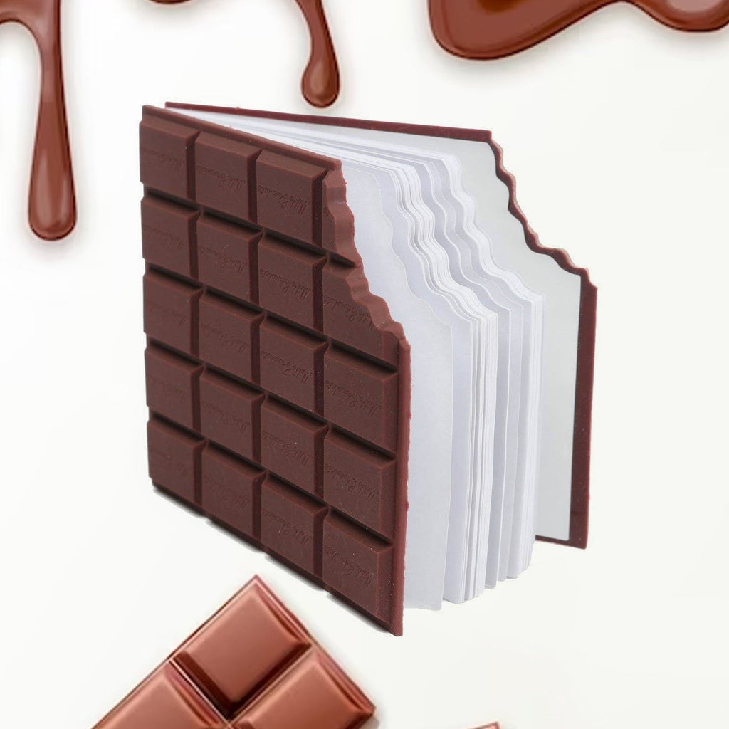 Closed chocolate scented diary with a bite-shape design on a white background.