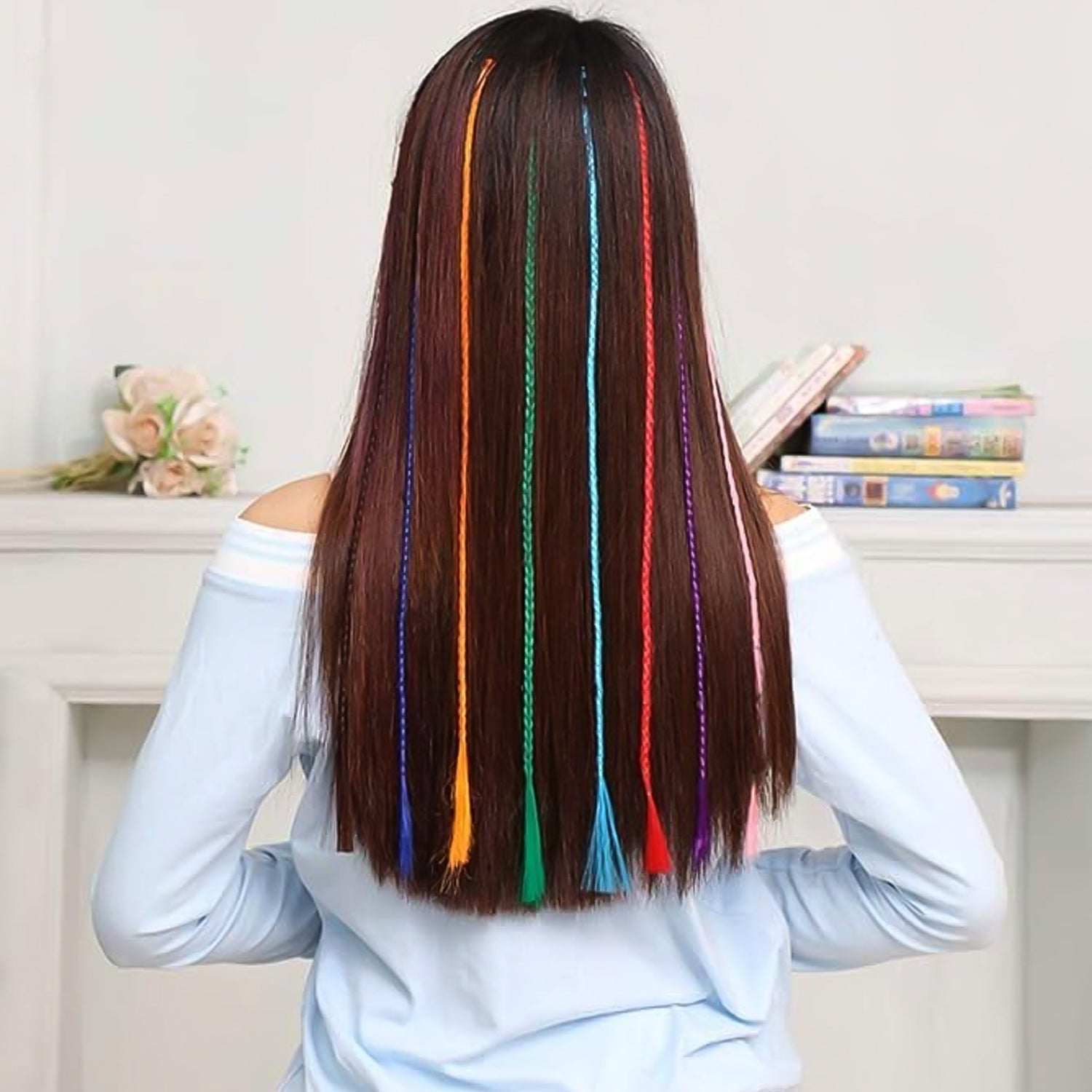 Hair claw clip displaying vibrant braided hair extension streaks for kids