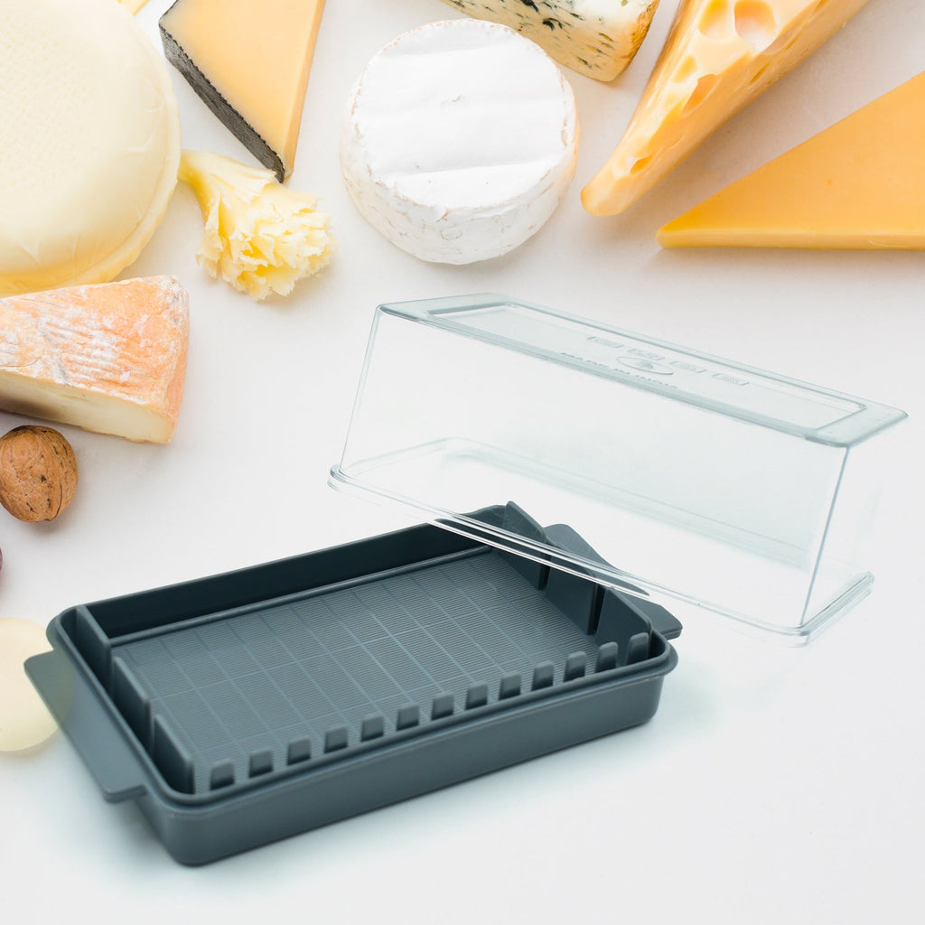 Detail view of the ingenious butter cutter mechanism within the transparent storage box.
