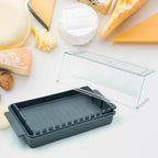 Detail view of the ingenious butter cutter mechanism within the transparent storage box.