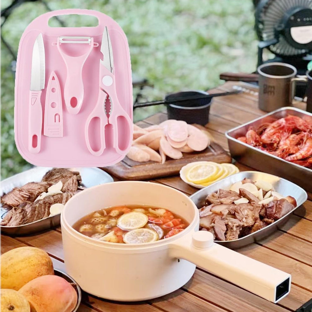 Travel cutting board set with knife, peeler, and kitchen scissors.