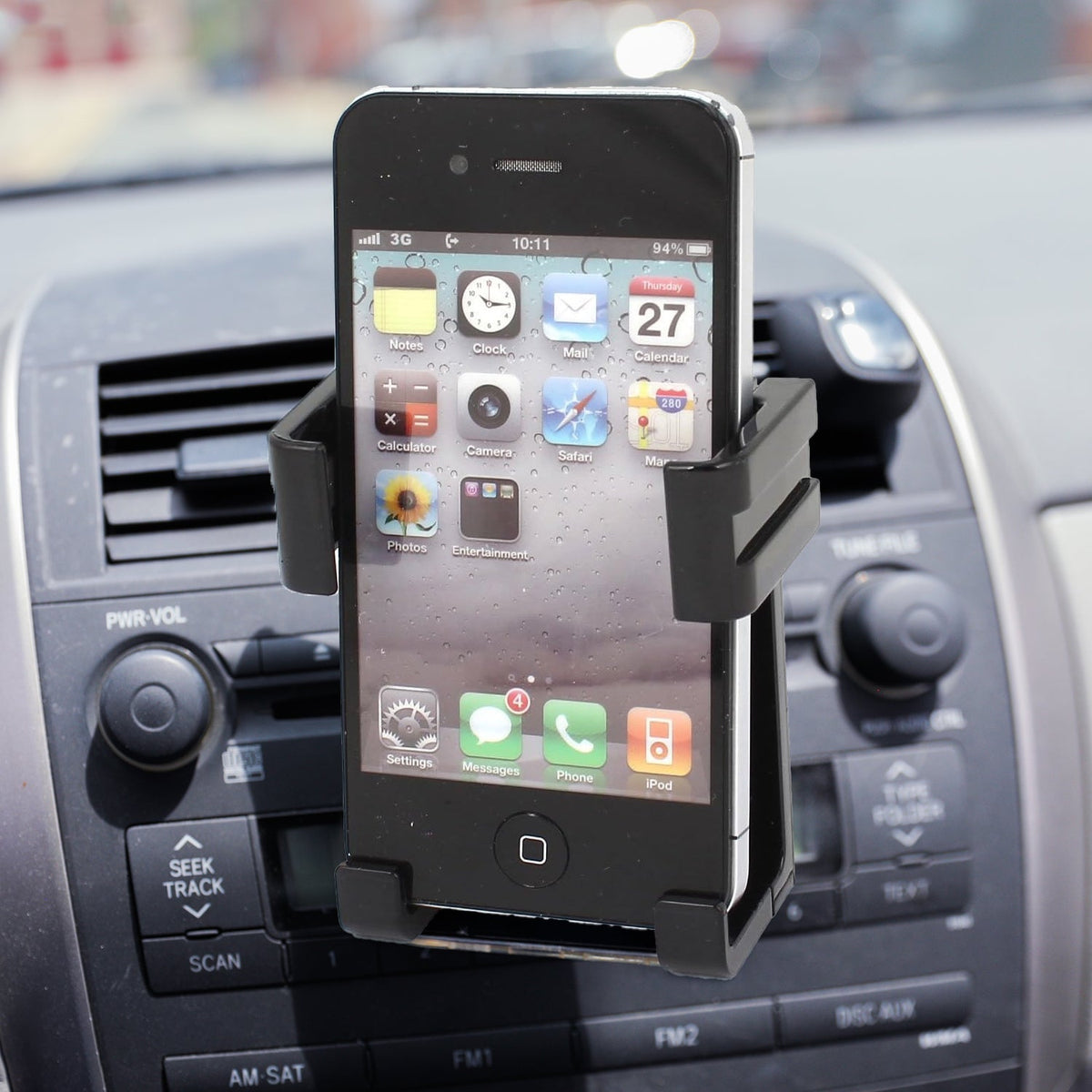 Car mobile holder securely mounted on a dashboard, displaying a smartphone for navigation.