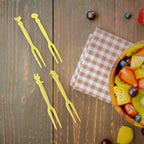 Plastic fruit forks arranged for party use