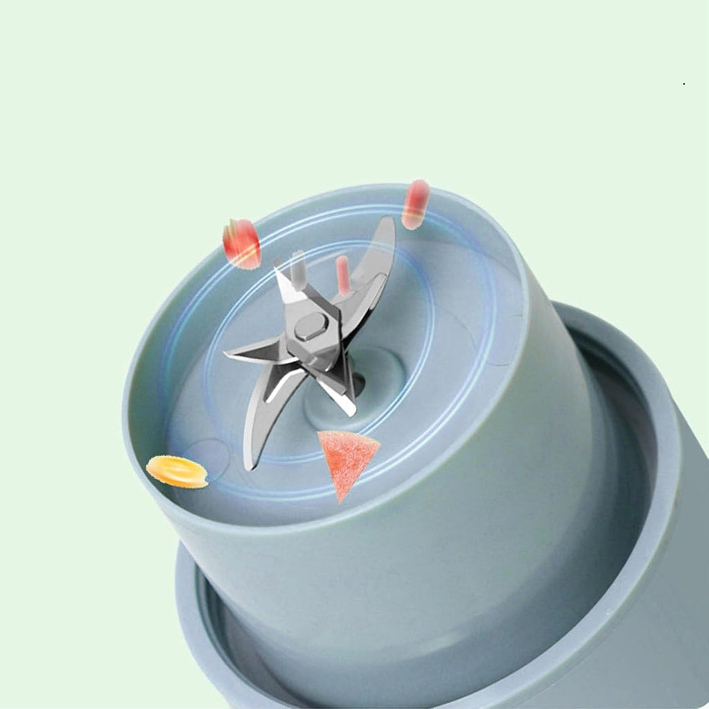 Compact electric juicer in action, blending fruits.