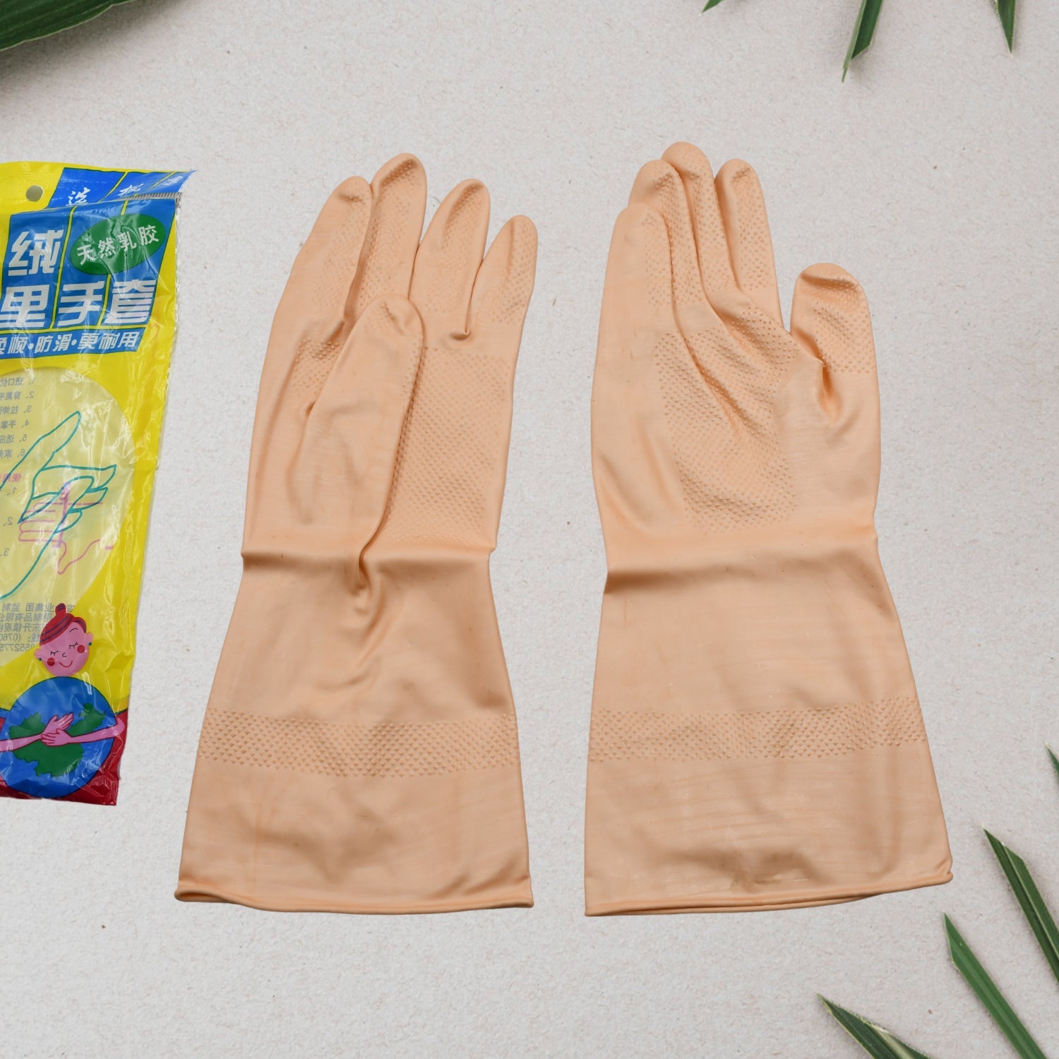 Pair of natural gum rubber cleaning gloves with a textured palm for secure grip.