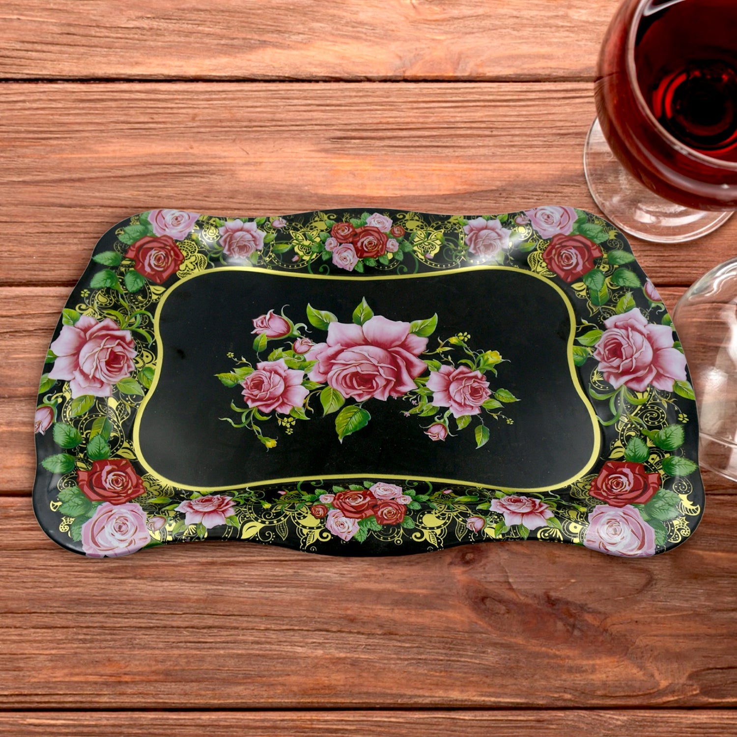 Stainless steel serving tray with a vibrant floral print on a white background.
