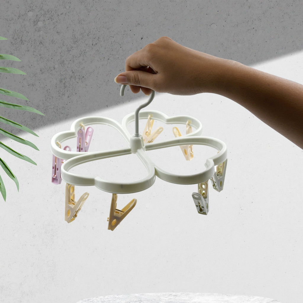 Detailed view of the plastic cloth drying rack's 360° swivel hook.