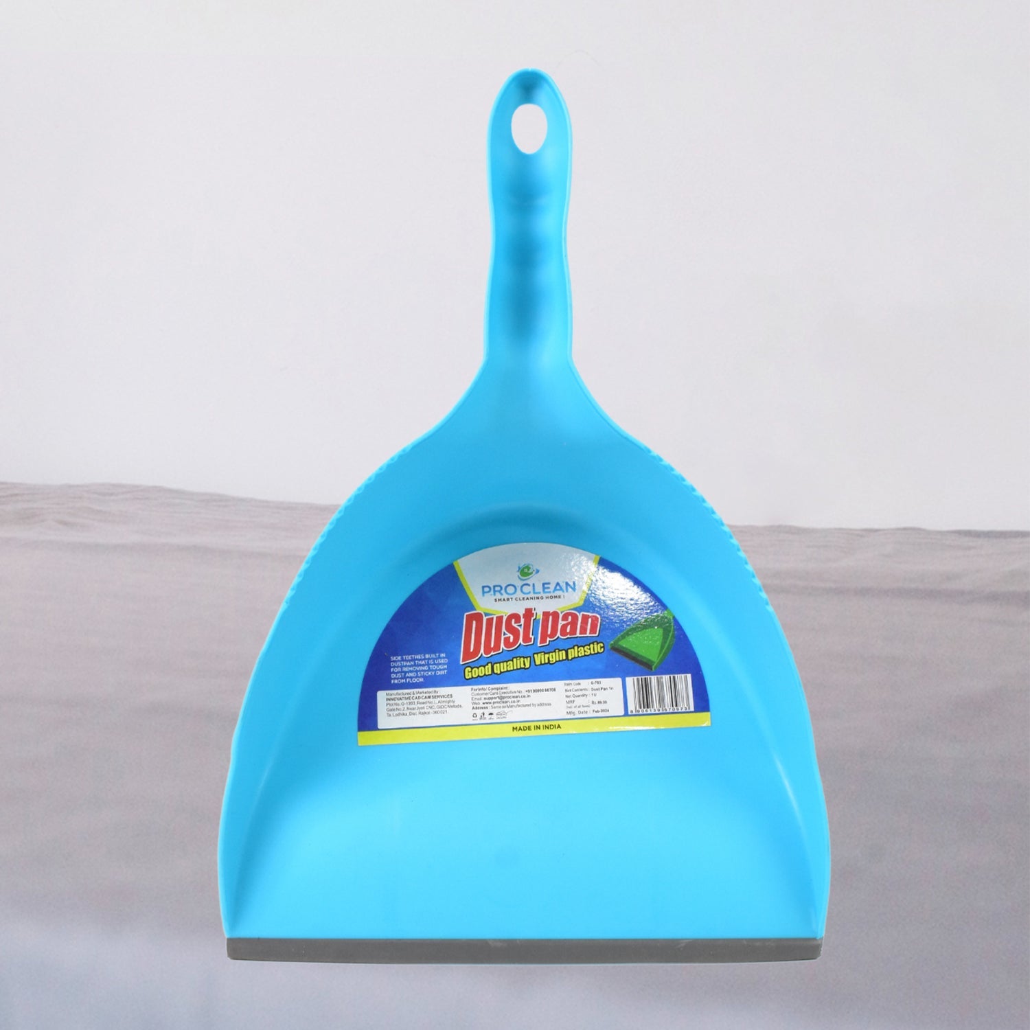 Durable plastic dustpan in action, showcasing its wide mouth for effective cleaning.