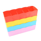 Top-down view of the multi-functional 5 grid compartment storage boxes, ready for organisation.