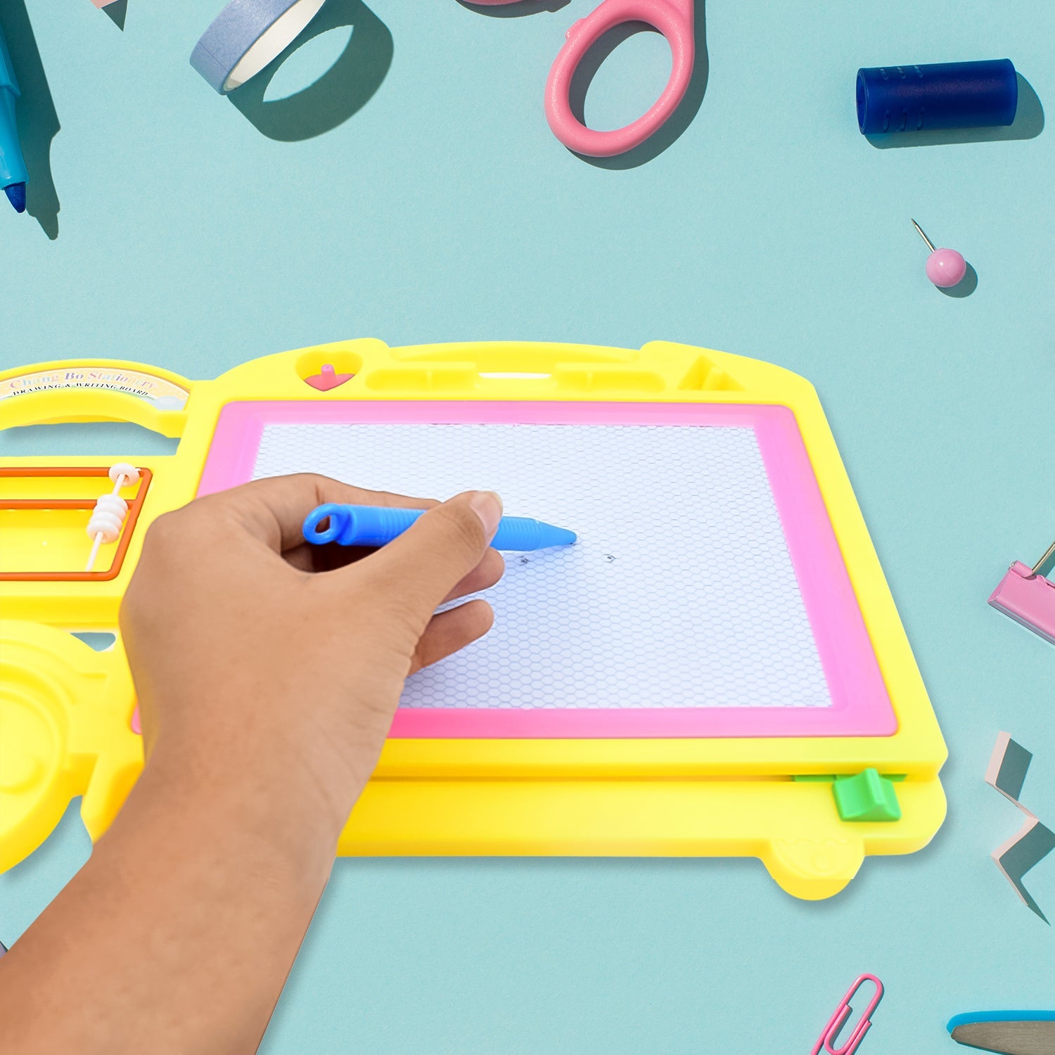 Front view of the vibrant bus-shaped erasable writing board for children.
