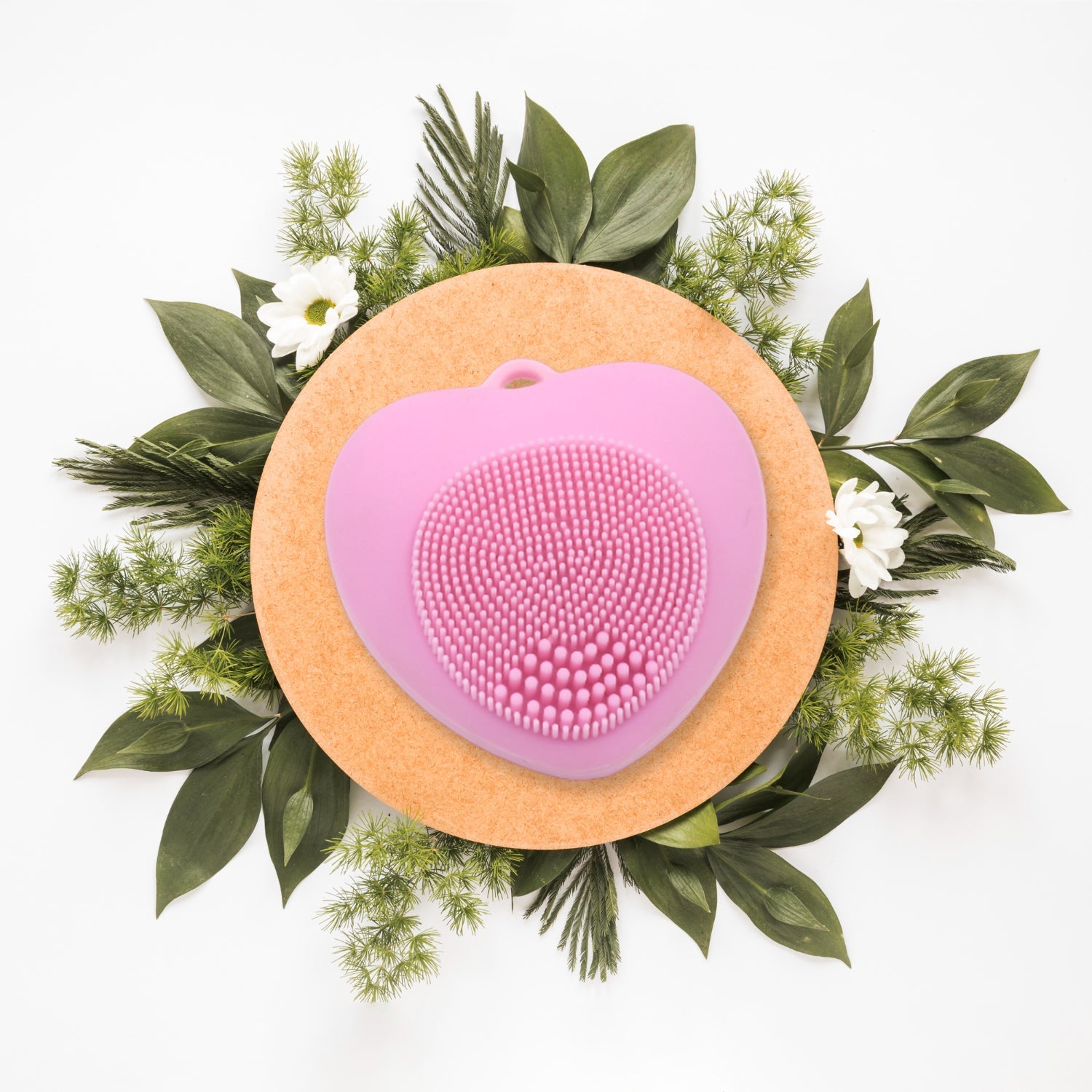 Waterproof heart-shaped silicone facial brush for gentle skin cleansing.