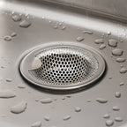 Stainless steel catcher strainer placed in kitchen sink drain opening