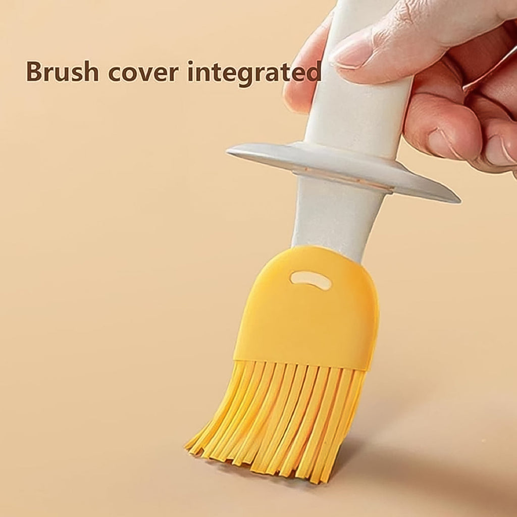 The clear oil dispenser bottle with its silicone brush detached, showcasing the two components.
