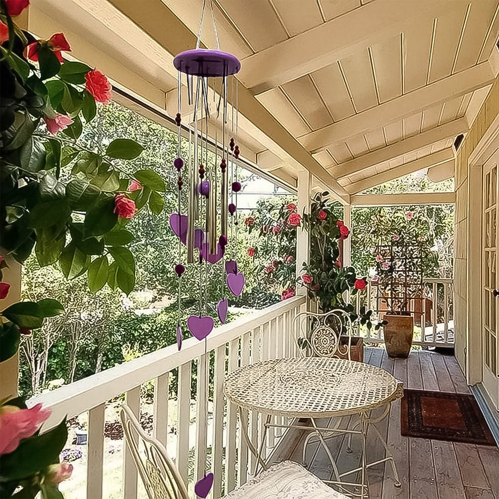 The musical wind chime with five aluminium tubes swaying gently in the breeze.