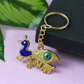 Golden Krishna Peacock keychain featuring intricate spiritual design