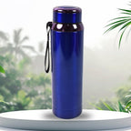 Outdoors view of stainless steel bottle in hand