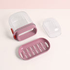 Oval-shaped plastic soap dish with detachable slotted drain tray for drying soap