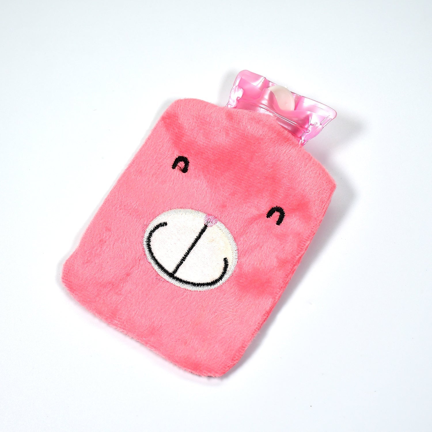 Lifestyle image showing the Pink Hot Water Bag providing warmth on a cold day.